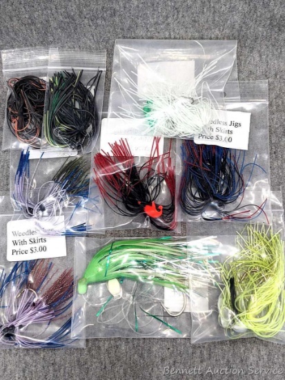 6 weedless jigs, plus other fishing lures up to about 4-1/2" over tail and head.
