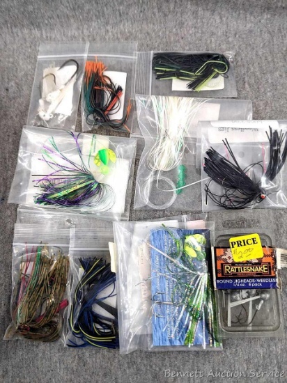 Weedless jigs with skirts, round jig heads, Fire Flies, more. Skirted jigs I measured were 1-3/4"