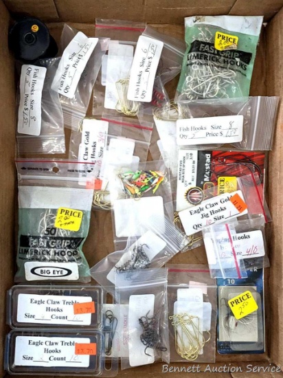 Variety of fish hooks up to about 2" long overall incl some springed ones and treble hooks; plus