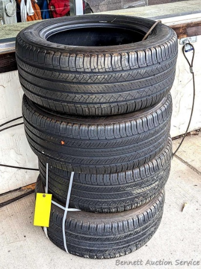 Set of 4 Michelin Latitude Tour HP tires are marked 255 / 55R18. Some weather checking noted in