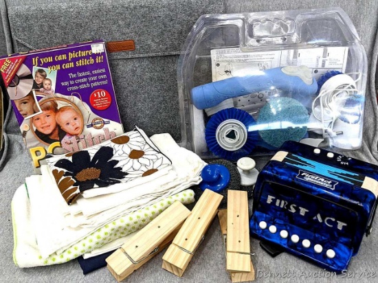 A collection of household items incl a Savfy felt carrying case (laptop computer?), a Black & Decker