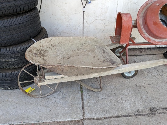 Delightful old wheelbarrow trough measures 23" x 33" and has a 15" wheel. Would make a great