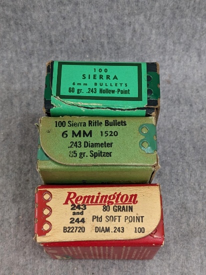 3 boxes of 6mm caliber bullets. 1 box of 85 grain Spitzers appears to be less than half full, 1 box