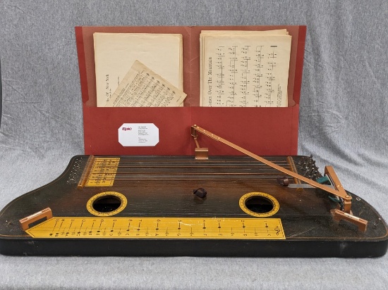 Vintage Hawaiian Tremoloa with sheet music. Measures 26" x 10" Supremely cool instrument with very