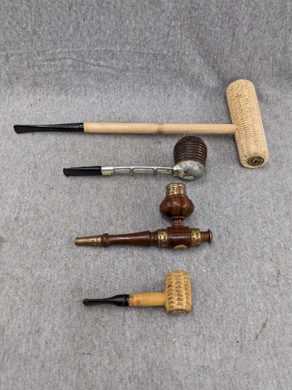 A couple of corn cob pipes, longer measures 11" long, smaller is 3-1/2" long. Wooden and gold finish