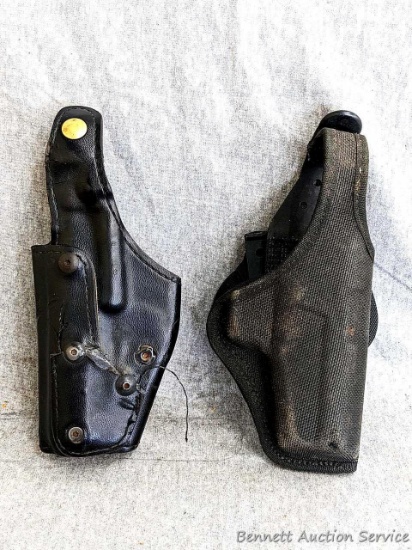 Pair of belt or hip gun holsters, both measure approx 8-1/2" long. Leather one is ready for