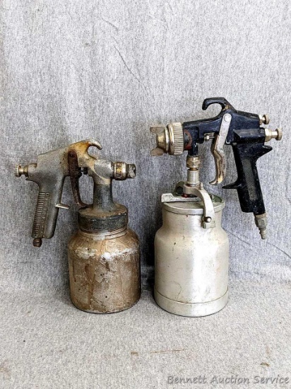 Pair of automotive refinishing paint sprayers. DeVilbiss measures approx 10" tall, other measures