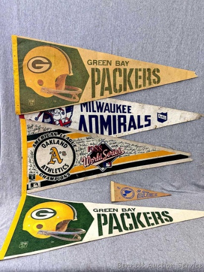Vintage Pennants incl St Louis Blues, Green Bay Packers, Oakland Athletics, and Milwaukee Admirals.