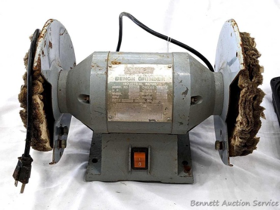 Heavy duty bench grinder is currently set up with 8" buffing wheels. Runs but needs to be started by