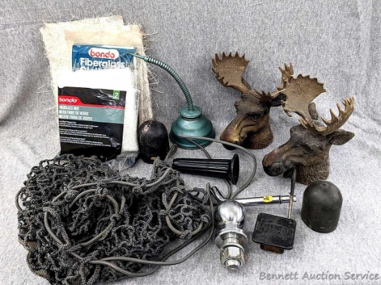 1-7/8" trailer hitch ball, cargo net measures 32" x 14" Trailer hitch covers, an oil can, fiberglass