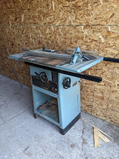 Delta 10" table saw is Model 7740/3421. Comes with guard, manual, more. Blade raises and lowers.