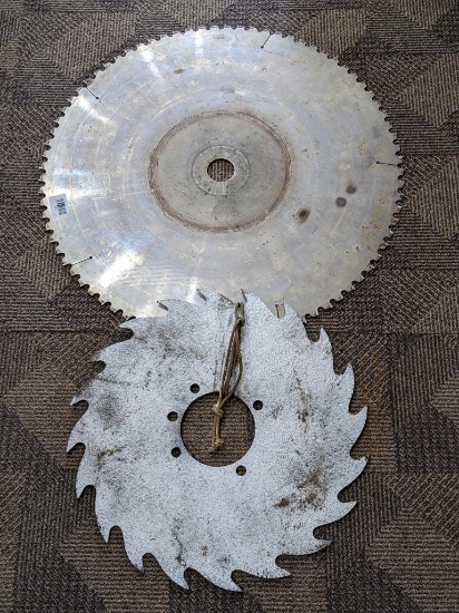 Large carbide tooth and other saw blades. Largest is 26" with a 2" arbor hole.