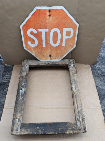 Metal stop sign and wooden platform dolly. Stop sign is 24" x 24" with mounting holes and has some