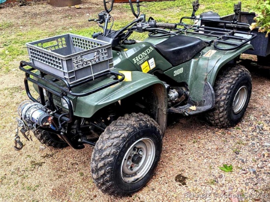 Honda Four Trax 300 four-wheeler with winch, gun racks, carry tote. Looks in very good condition