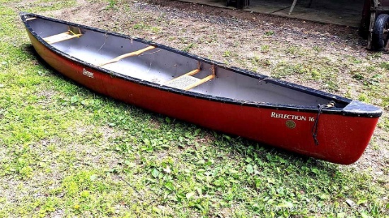 Dagger brand Reflection 16' fiberglass canoe is in good condition and has two caned seats.