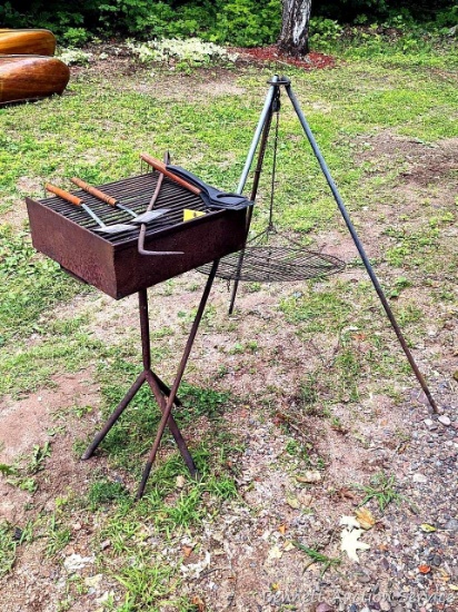 Charcoal grill is reminiscent of those at the local parks, plus a tripod and some grilling utensils.