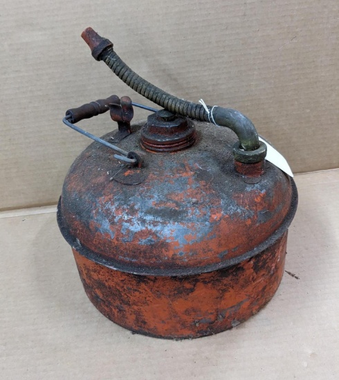 Eagle brand gooseneck gas can is old enough to have a wooden and wire handle. Approx. 11" across.