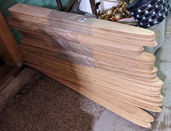 Stack of fur stretchers; stack measures 18" tall and each one measures 36" long.