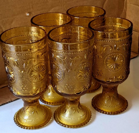 Vintage amber colored stemmed glasses, set of 5; measures 6" tall.