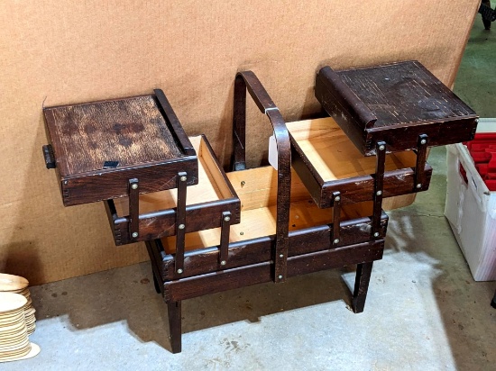 Sewing stand is 21" wide x 22" to top of handle x 12" wide. One leg seems loose, but in overall good