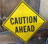 Metal Caution sign is nearly 1-1/2' across.