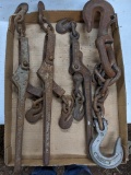 Three chain binders, 1-1/2' long. Plus a lifting chain with heavy hooks.