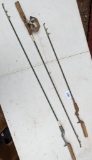 Three telescopic fishing rods and a reel. Longest are 44