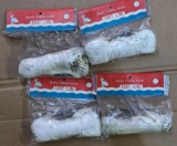 Four unopened trot line packages, each 150 ft long with 25 fish hooks.
