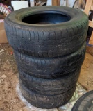 Four Bridgestone Dueler H/T 687 tires 235/60R16 100H. Light checking in tread, best depth I could