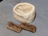 Light colored mink ladies pillbox hat, plus two mink cuffs.