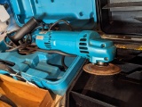 Makita 4'' disk grinder, runs and has good cord, comes with handle guard, case, wire brush and more,