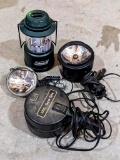 Coleman battery lantern; two shining lights by Brinkmann and one older style light.