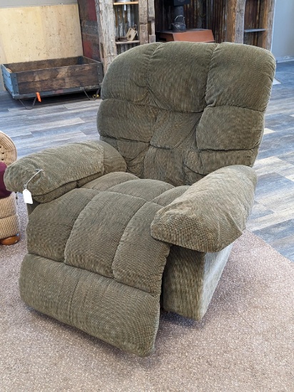 LaZBoy recliner with nice upholstery needs repair in back and foot rest.
