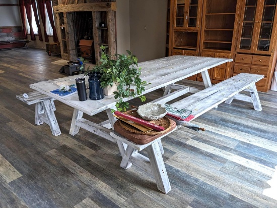 Really cool wooden dining table has two sturdy benches. Table measures nearly 10' long x 43" wide x