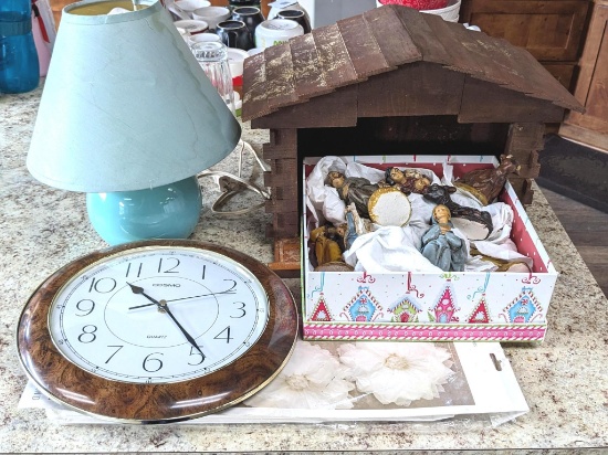 Nativity set with figures up to 6", plus battery wall clock, 12" tall lamp. Wooden display is 15"