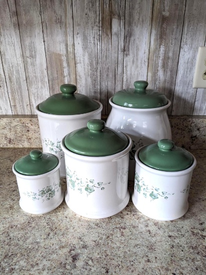 Ivy pattern canister set. Largest canister is approx. 10" tall. Second to smallest has a hole near