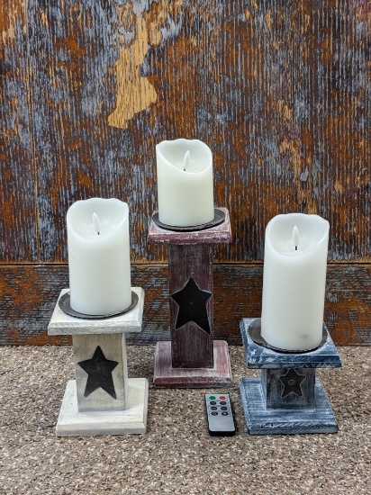 Three folk art pillars with battery operated candles. Tallest with candle is 13".