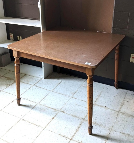 40" square kitchen table is sturdy and in good condition.