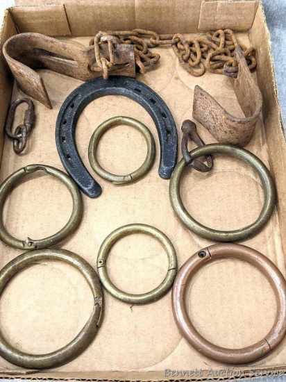 Five brass wrings, a copper ring, horse shoe, more.