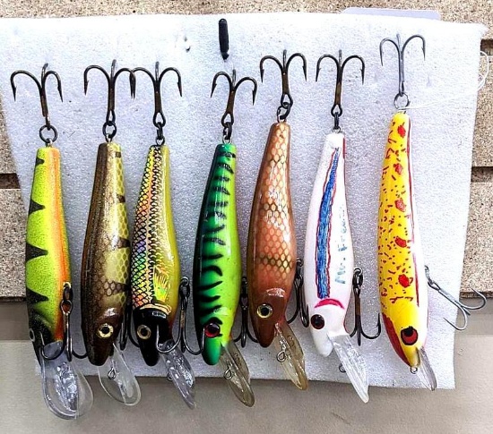 Seven fishing lures are about 7" long and great for musky and other game fish.