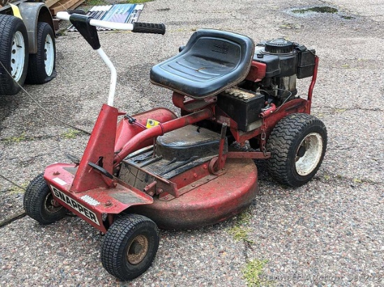 Snapper riding lawn mower has a Formula 8 Industrial Tecumseh engine and a 28" deck. Three of the