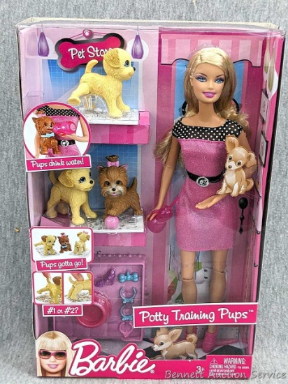 2009 Barbie Potty Training Pups set is new in package. Box measures approx. 13" x 9" x 2-1/2".