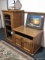 Nice wooden cabinet in good condition has a leaded glass door. Measures about 52