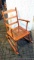 Nice little rocking chair has a caned seat and is in very nice condition.