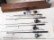 Four 2-piece fishing rods. Two Abu Garcia Hellbender rods with Cardinal 963 and 964 reels; other