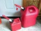 Two gas totes, larger is a 6 gallon, and both have spouts, and the smaller one is almost full of 2