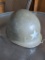 US military metal helmet with chin strap, but no liner.