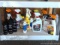 Full and partial bottles of automotive cleaners including leather cleaner, scratch out, tire white,