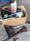 Several bottles of ATV oil, yard torch and fuel, and more.