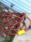 Length of garden hose with sprayer nozzle.